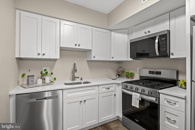 411 N Stiles Ave Unit A5, Maple Shade, NJ 08052 - kitchen with appliances with stainless steel finishes, white cabinets, and dark wood finished floors
