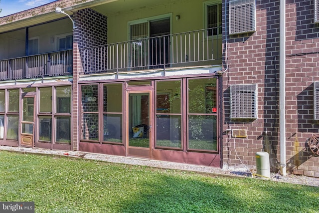 411 N Stiles Ave Unit A5, Maple Shade, NJ 08052 - rear view of property featuring brick siding, a balcony, and a lawn