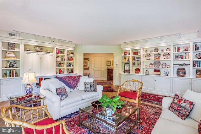 5610 Wisconsin Ave Unit 406, Chevy Chase, MD 20815 - living room with rail lighting and wood finished floors