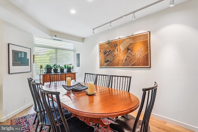 5610 Wisconsin Ave Unit 406, Chevy Chase, MD 20815 - dining room featuring light wood finished floors, track lighting, and recessed lighting