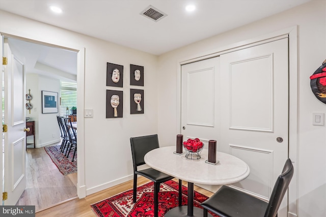 5610 Wisconsin Ave Unit 406, Chevy Chase, MD 20815 - dining area with light wood finished floors and recessed lighting