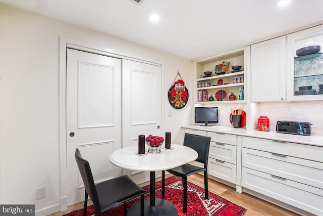 5610 Wisconsin Ave Unit 406, Chevy Chase, MD 20815 - dining space with light wood-style floors and recessed lighting