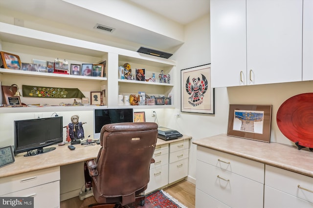 5610 Wisconsin Ave Unit 406, Chevy Chase, MD 20815 - office featuring built in study area and light wood-style flooring