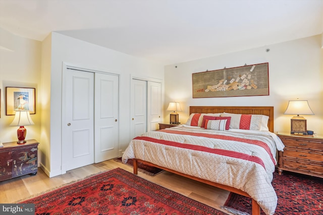 5610 Wisconsin Ave Unit 406, Chevy Chase, MD 20815 - bedroom featuring wood finished floors and multiple closets