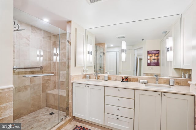5610 Wisconsin Ave Unit 406, Chevy Chase, MD 20815 - bathroom featuring double vanity, a shower stall, and tile patterned flooring
