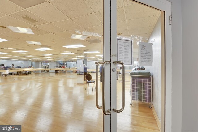 5610 Wisconsin Ave Unit 406, Chevy Chase, MD 20815 - workout area with a paneled ceiling and wood finished floors