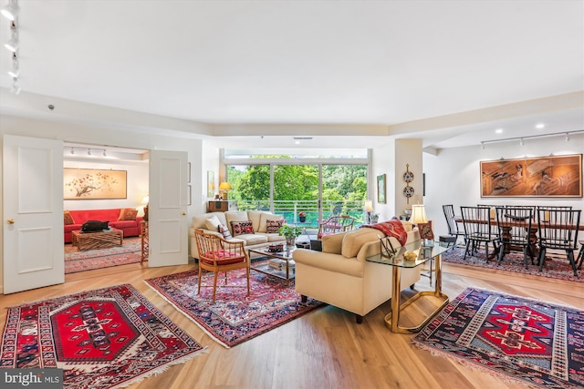 5610 Wisconsin Ave Unit 406, Chevy Chase, MD 20815 - living area featuring track lighting and wood finished floors