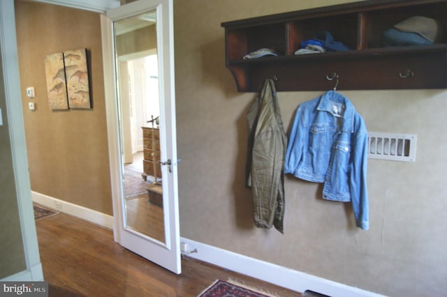 4305 Bradley Ln, Chevy Chase, MD 20815 - mudroom featuring wood finished floors and baseboards