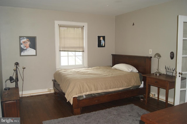 4305 Bradley Ln, Chevy Chase, MD 20815 - bedroom featuring wood finished floors and baseboards
