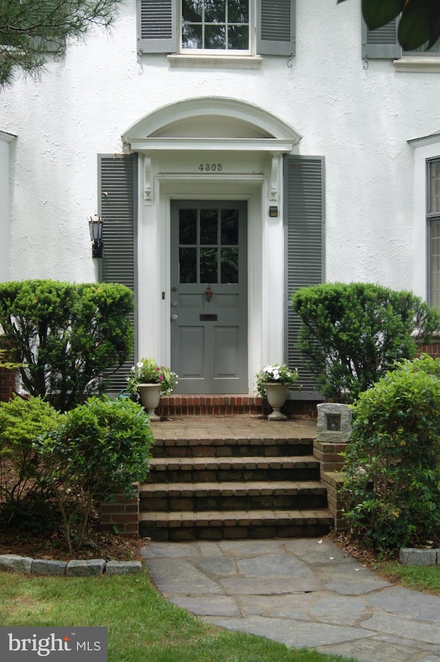 4305 Bradley Ln, Chevy Chase, MD 20815 - view of exterior entry with stucco siding
