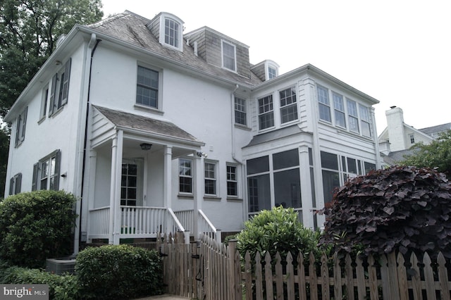4305 Bradley Ln, Chevy Chase, MD 20815 - view of front of house featuring stucco siding and central air condition unit