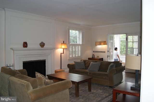 4305 Bradley Ln, Chevy Chase, MD 20815 - living area with healthy amount of natural light, crown molding, a fireplace, and wood finished floors