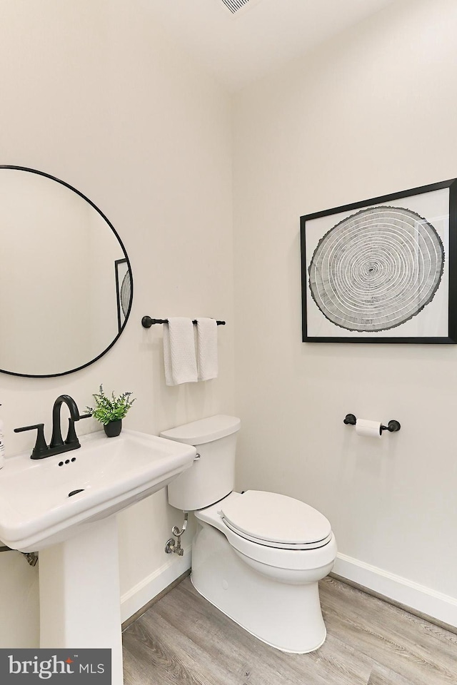 23219 Christopher Thomas Ln, Brambleton, VA 20148 - half bathroom with wood finished floors
