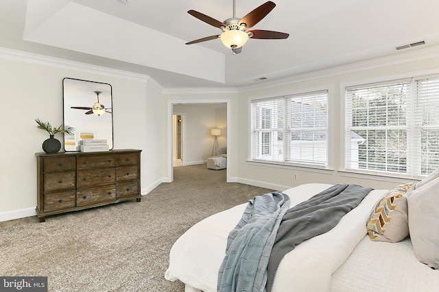 23219 Christopher Thomas Ln, Brambleton, VA 20148 - carpeted bedroom featuring crown molding, multiple windows, a tray ceiling, and a ceiling fan