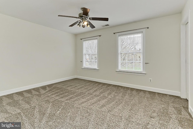 23219 Christopher Thomas Ln, Brambleton, VA 20148 - spare room featuring dark colored carpet and ceiling fan