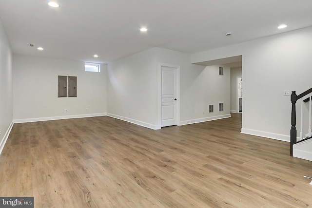 23219 Christopher Thomas Ln, Brambleton, VA 20148 - below grade area featuring recessed lighting, wood finished floors, stairs, and electric panel