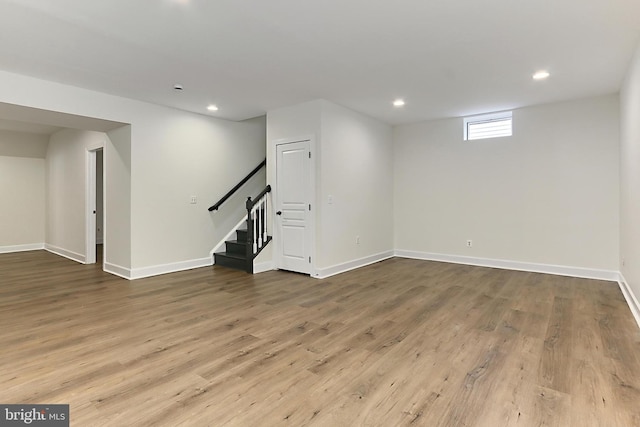 23219 Christopher Thomas Ln, Brambleton, VA 20148 - basement featuring stairs, recessed lighting, and wood finished floors