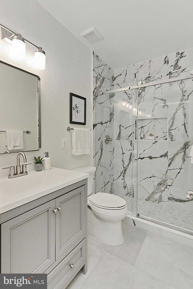 23219 Christopher Thomas Ln, Brambleton, VA 20148 - full bathroom with marble look tile flooring, a marble finish shower, and vanity