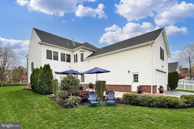 23219 Christopher Thomas Ln, Brambleton, VA 20148 - rear view of house featuring a garage and brick siding
