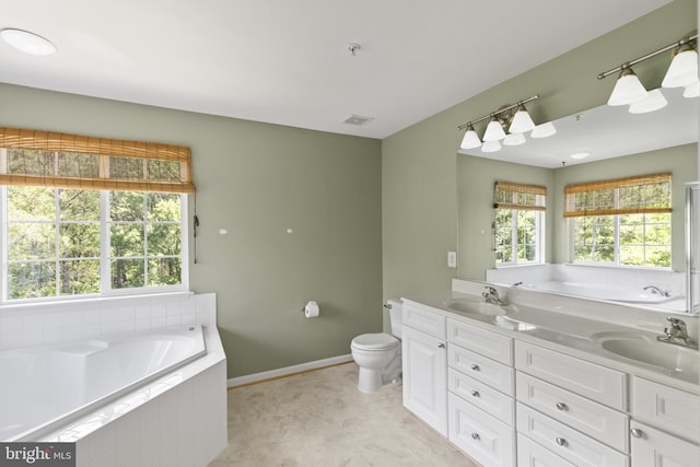 1562 Falling Brook Ct, Odenton, MD 21113 - bathroom featuring a garden tub, double vanity, baseboards, toilet, and tile patterned floors