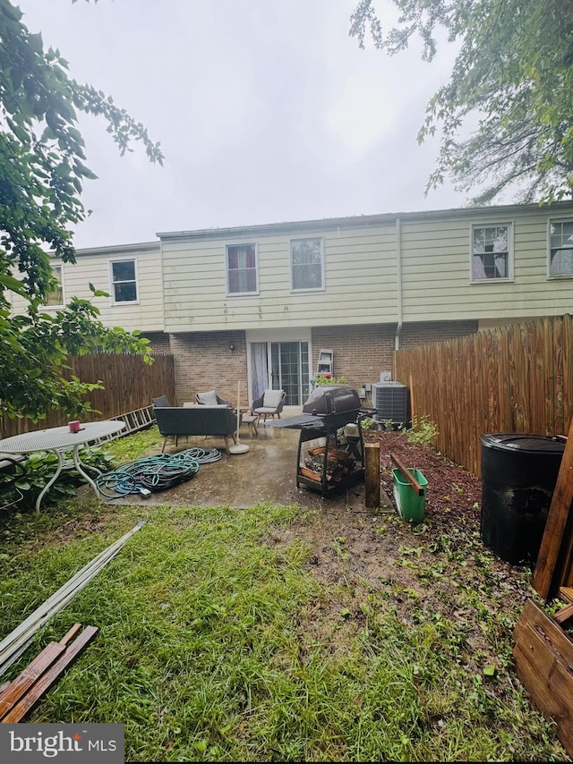 11529 Fenchurch Ct, Germantown, MD 20876 - back of property with a patio area, brick siding, and cooling unit
