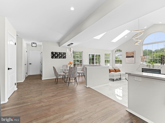 44 Wilson Dr, Sicklerville, NJ 08081 - kitchen with a chandelier, a skylight, healthy amount of natural light, light wood finished floors, and recessed lighting