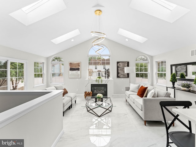 44 Wilson Dr, Sicklerville, NJ 08081 - living area with a skylight, light marble finish flooring, a fireplace, lofted ceiling, and baseboards
