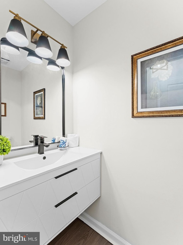 44 Wilson Dr, Sicklerville, NJ 08081 - bathroom featuring vanity, wood finished floors, and baseboards
