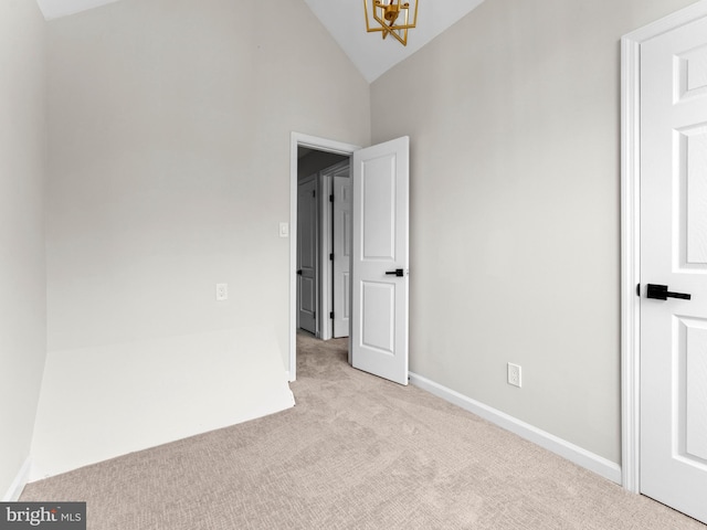 44 Wilson Dr, Sicklerville, NJ 08081 - empty room with carpet floors, a chandelier, baseboards, and high vaulted ceiling