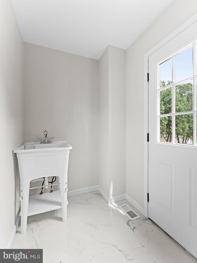 44 Wilson Dr, Sicklerville, NJ 08081 - laundry area featuring baseboards, marble finish flooring, and a sink