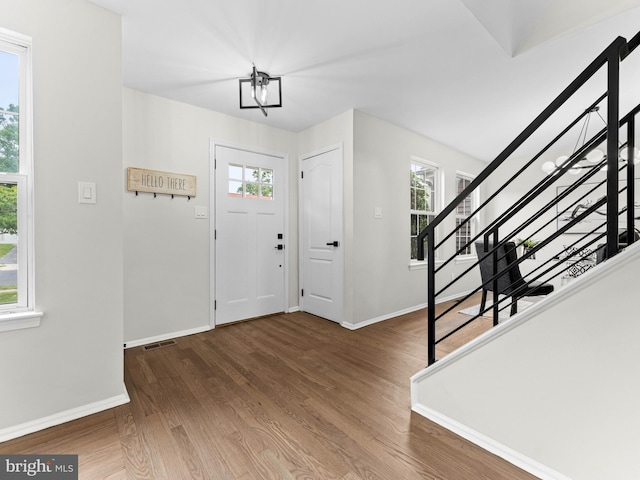 44 Wilson Dr, Sicklerville, NJ 08081 - foyer featuring stairway, baseboards, and wood finished floors