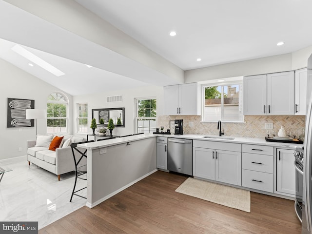 44 Wilson Dr, Sicklerville, NJ 08081 - kitchen featuring appliances with stainless steel finishes, a sink, tasteful backsplash, light countertops, and recessed lighting