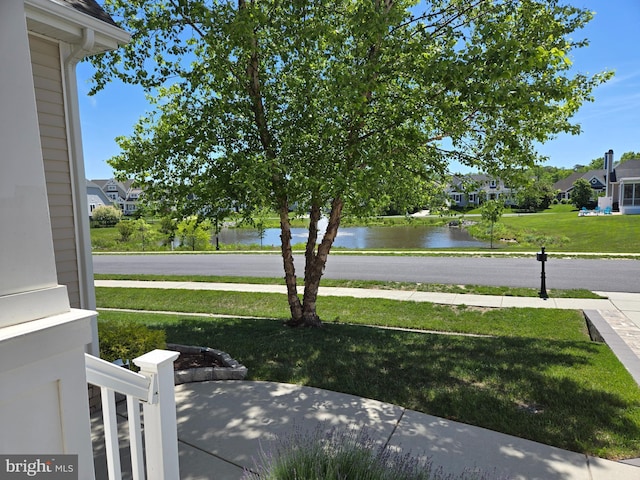 35516 Hedgerow Ln, Rehoboth Beach, DE 19971 - view of green lawn featuring a water view and a residential view