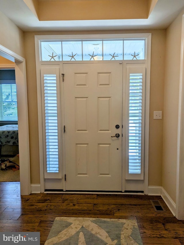 35516 Hedgerow Ln, Rehoboth Beach, DE 19971 - foyer with dark wood-style floors and baseboards