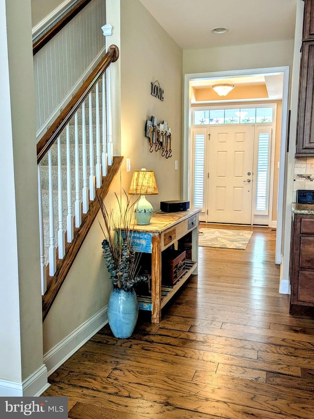 35516 Hedgerow Ln, Rehoboth Beach, DE 19971 - foyer with hardwood / wood-style flooring, baseboards, and stairs