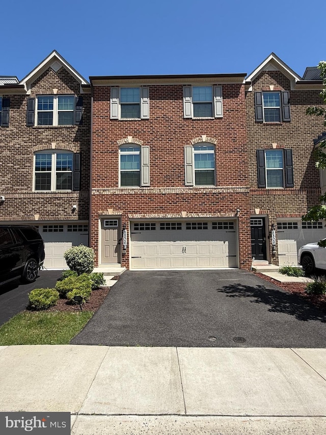 5806 Richmanor Ter, Upper Marlboro, MD 20772 - view of property with driveway, an attached garage, and brick siding