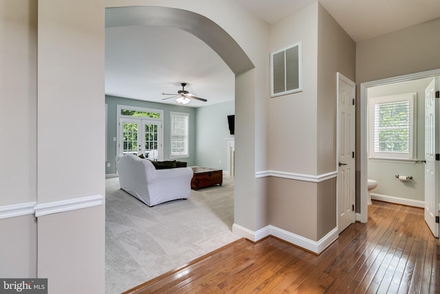 6422 Hard Bargain Cir, Indian Head, MD 20640 - hall featuring arched walkways, hardwood / wood-style flooring, baseboards, and french doors