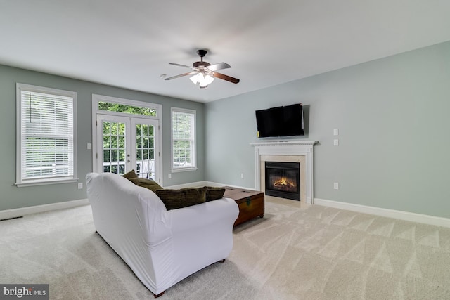 6422 Hard Bargain Cir, Indian Head, MD 20640 - living room featuring french doors, light colored carpet, ceiling fan, and plenty of natural light