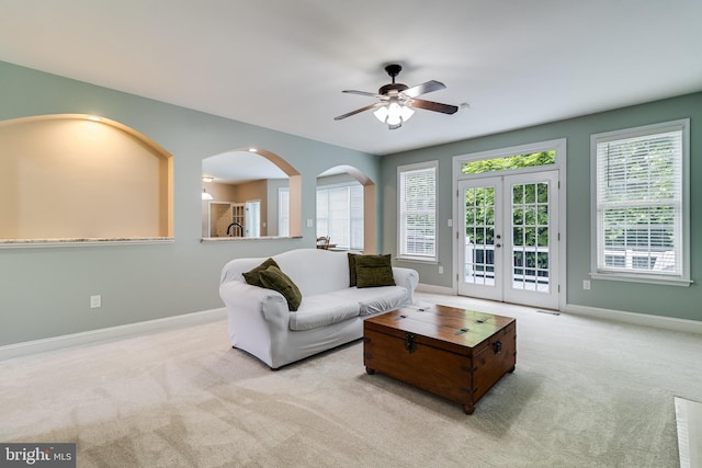 6422 Hard Bargain Cir, Indian Head, MD 20640 - carpeted living room featuring plenty of natural light, baseboards, a ceiling fan, and french doors