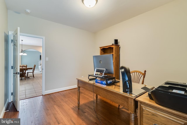 6422 Hard Bargain Cir, Indian Head, MD 20640 - home office with wood finished floors, arched walkways, baseboards, and a chandelier