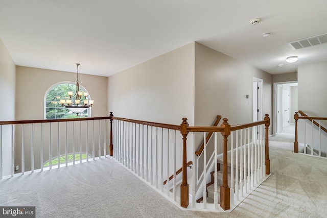 6422 Hard Bargain Cir, Indian Head, MD 20640 - hallway with an upstairs landing, carpet flooring, and a chandelier