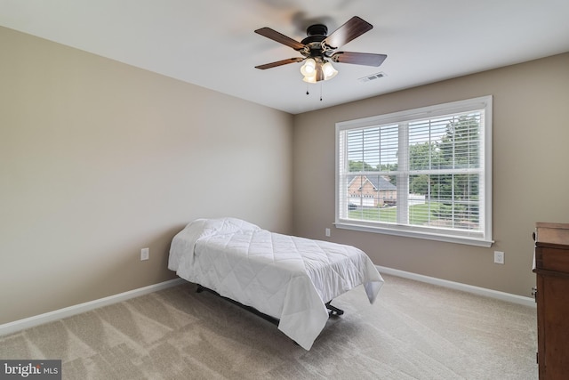 6422 Hard Bargain Cir, Indian Head, MD 20640 - bedroom with light carpet, baseboards, and ceiling fan