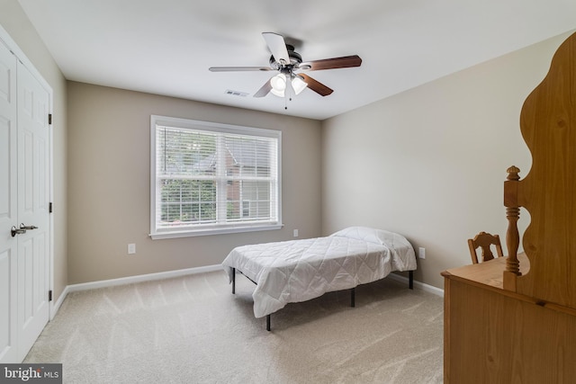 6422 Hard Bargain Cir, Indian Head, MD 20640 - bedroom with light colored carpet, baseboards, ceiling fan, and a closet