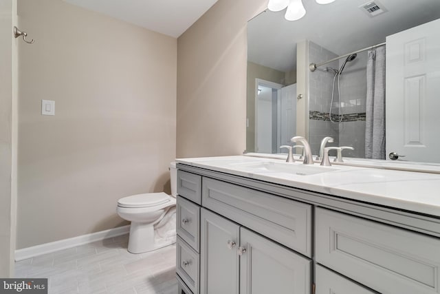 6422 Hard Bargain Cir, Indian Head, MD 20640 - full bathroom featuring vanity, toilet, baseboards, and curtained shower