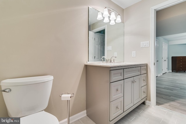 6422 Hard Bargain Cir, Indian Head, MD 20640 - bathroom with vanity, toilet, baseboards, and a chandelier