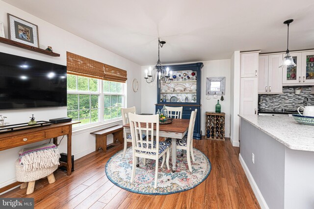 706 Melvin Rd, Telford, PA 18969 - dining room with dark wood-type flooring, a chandelier, and baseboards