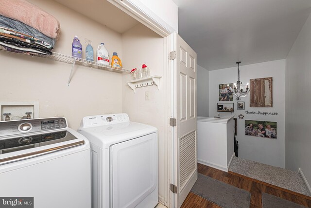706 Melvin Rd, Telford, PA 18969 - laundry room featuring washing machine and dryer, a chandelier, wood finished floors, and baseboards