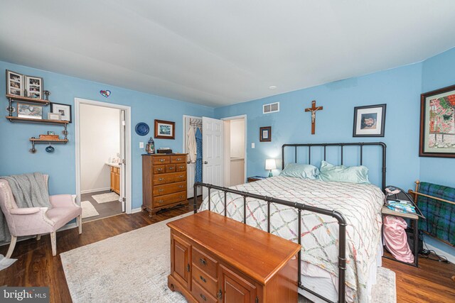 706 Melvin Rd, Telford, PA 18969 - bedroom featuring dark wood-style flooring and connected bathroom