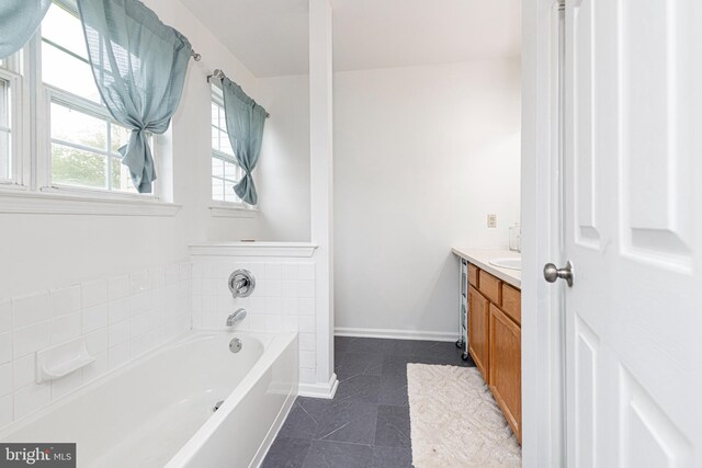 706 Melvin Rd, Telford, PA 18969 - full bathroom featuring vanity, a bath, tile patterned floors, and baseboards