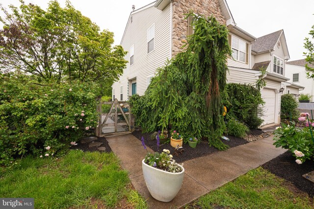 706 Melvin Rd, Telford, PA 18969 - view of home's exterior with a gate and stone siding